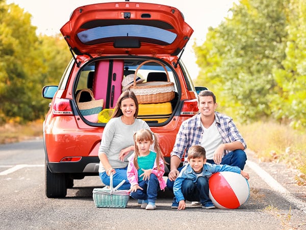 Family on a road trip with a rental car